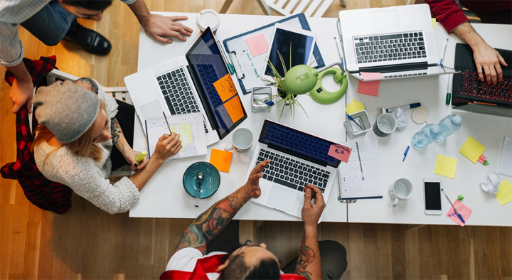 A team is working on a project together in a company office.